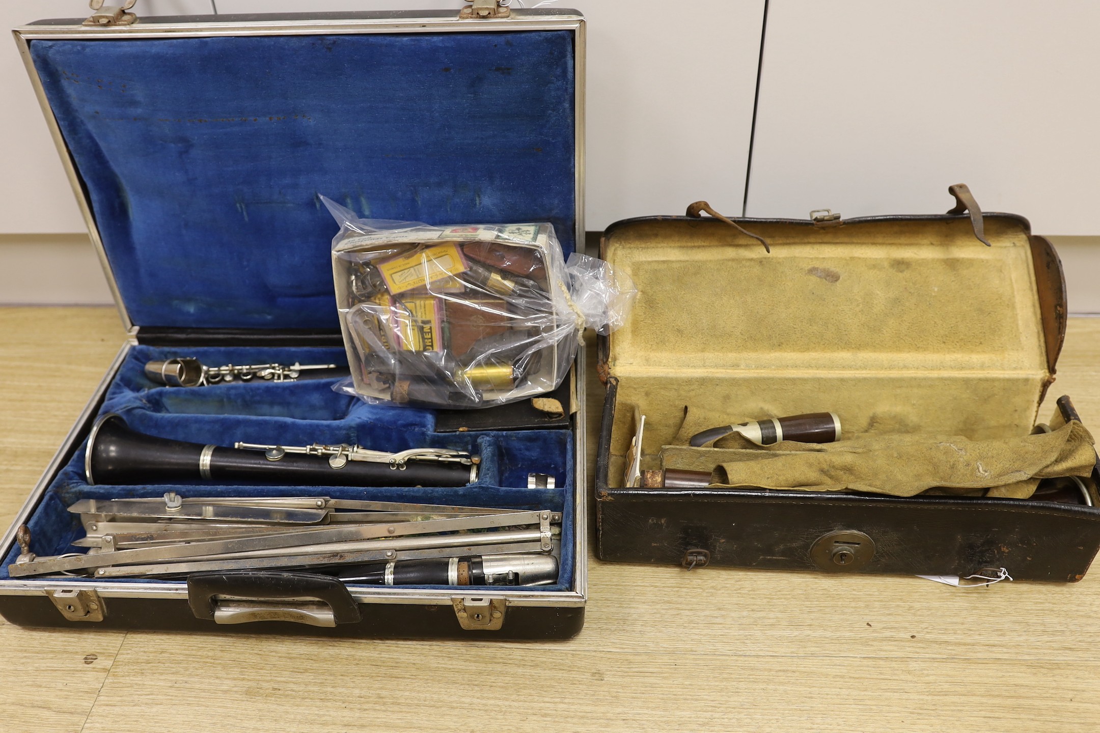 A French Buffet clarinet and two 19th century 'Simple System' clarinets, cased as one